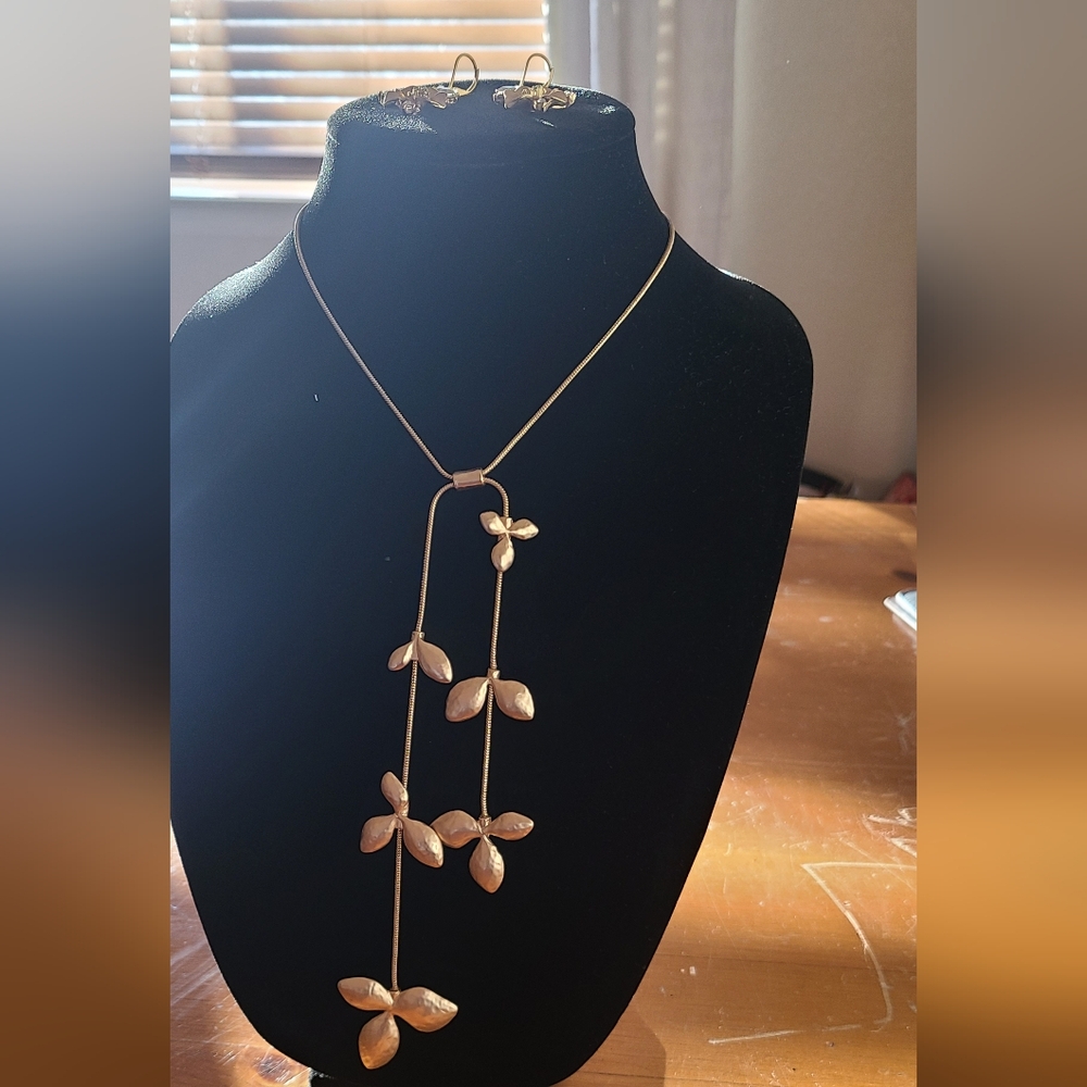 Matte gold adjustable leaf necklace and 2" drop matte gold flower earrings